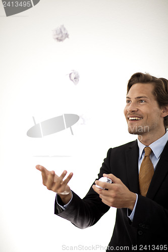 Image of Accomplished businessman juggling paper