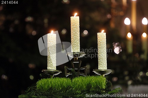 Image of Burning candles on church altar