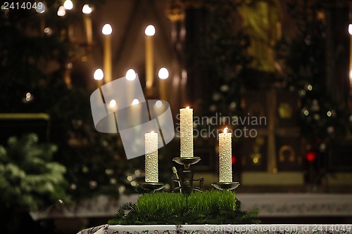 Image of Burning candles on church altar