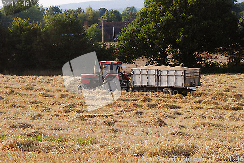 Image of Tractor with a trailer full of grain