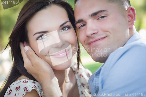 Image of Mixed Race Romantic Couple Portrait in the Park