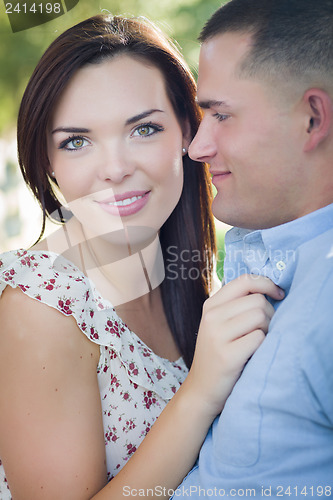 Image of Mixed Race Romantic Couple Portrait in the Park