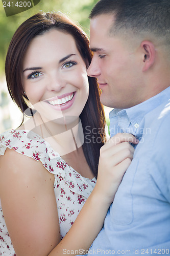 Image of Mixed Race Romantic Couple Portrait in the Park