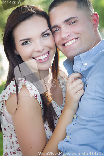 Image of Mixed Race Romantic Couple Portrait in the Park