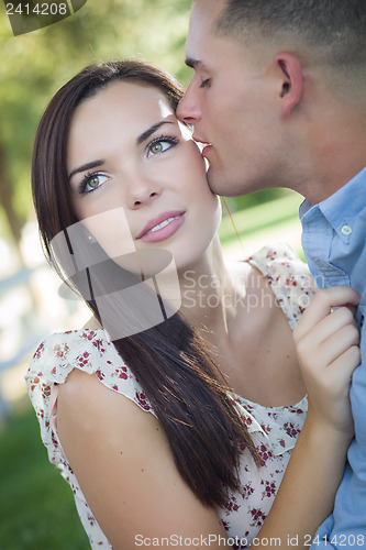 Image of Mixed Race Romantic Couple Portrait in the Park