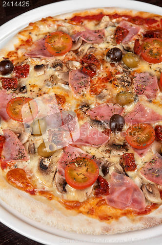 Image of pizza with ham and mushrooms