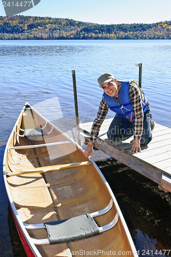 Image of Man with canoe