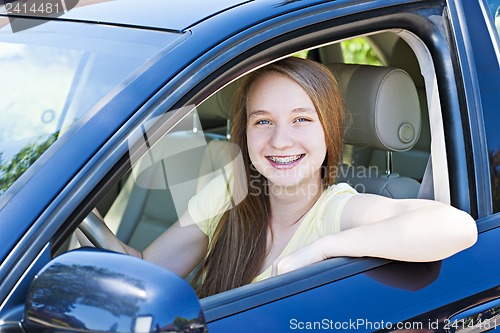 Image of Teenage girl learning to drive