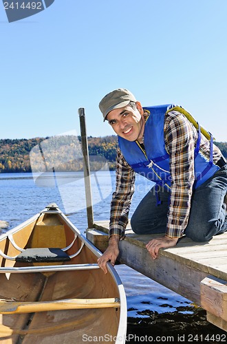 Image of Man with canoe