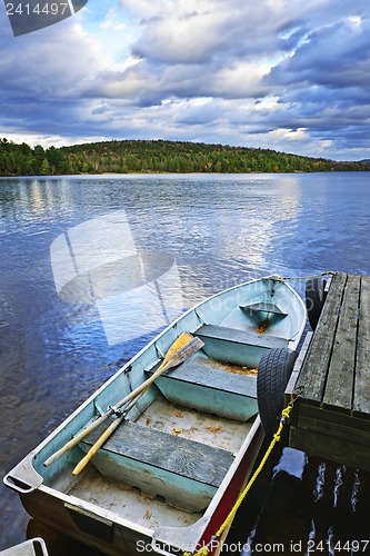 Image of Rowboat docked on lake