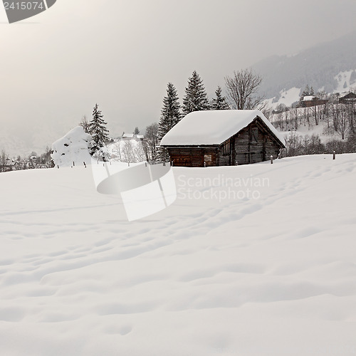 Image of Barn on Snowy Field