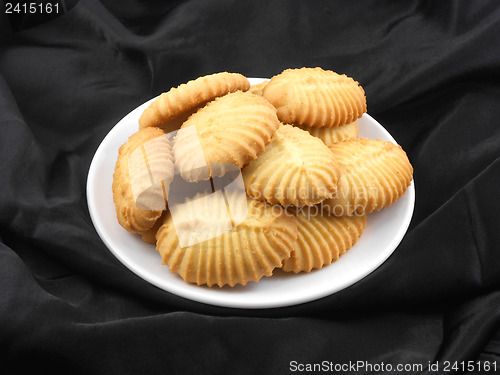 Image of cupcake on black material background