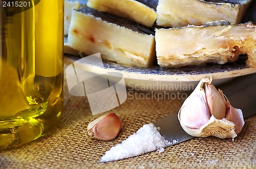 Image of Codfish, olive oil and garlic. 