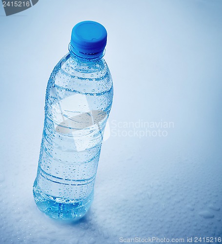 Image of wet plastic bottle of water