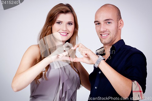 Image of young attractive couple in love embracing portrait