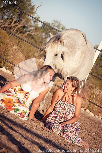 Image of two woman horse and dog outdoor in summer happy