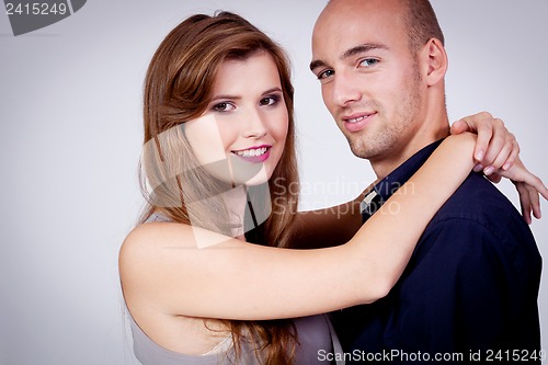 Image of young attractive couple in love embracing portrait