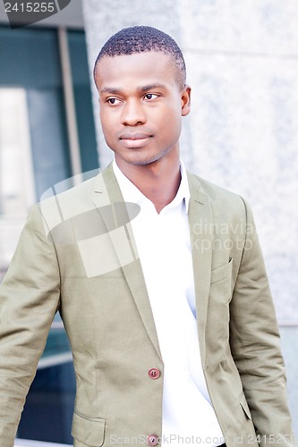 Image of young successful african business man outdoor in summer