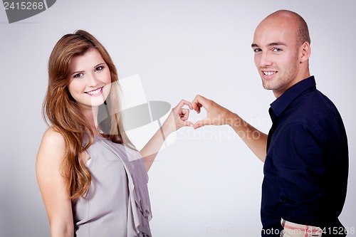 Image of young attractive couple in love embracing portrait