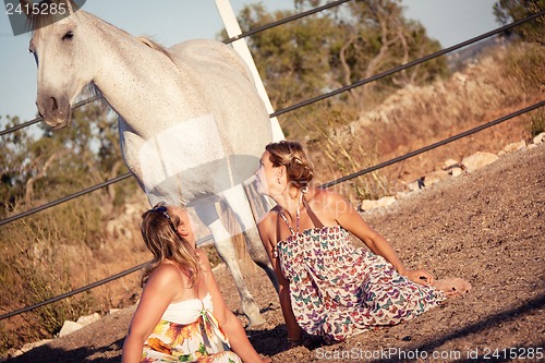 Image of two woman horse and dog outdoor in summer happy