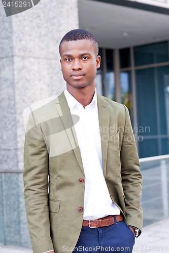 Image of young successful african business man outdoor in summer