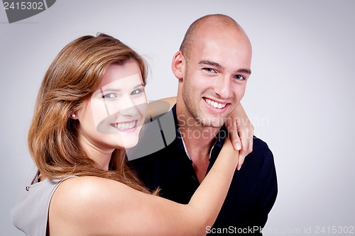 Image of young attractive couple in love embracing portrait