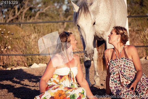 Image of two woman horse and dog outdoor in summer happy