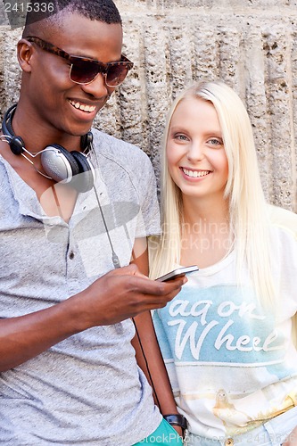 Image of happy young couple have fun in the city summertime 