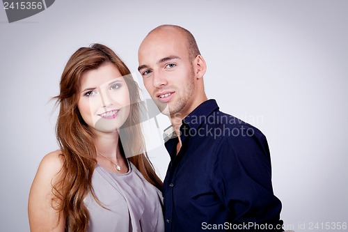 Image of young attractive couple in love embracing portrait