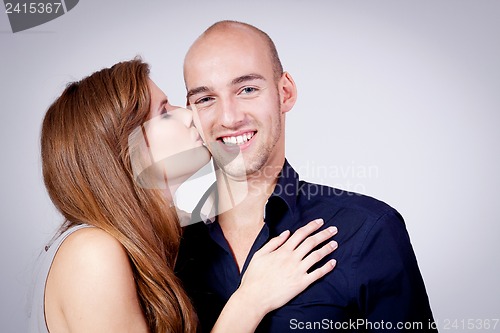 Image of young attractive couple in love embracing portrait