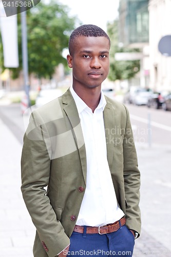 Image of young successful african business man outdoor in summer