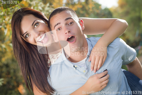 Image of Mixed Race Romantic Couple Portrait in the Park