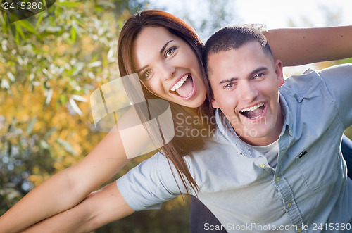 Image of Mixed Race Romantic Couple Portrait in the Park