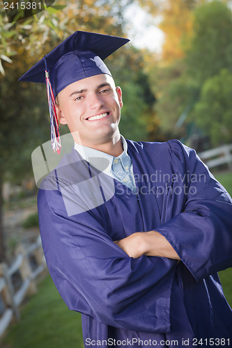 Image of Handsome Male Graduate in Cap and Gown