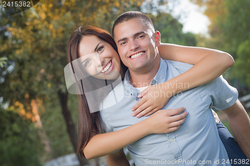 Image of Mixed Race Romantic Couple Portrait in the Park