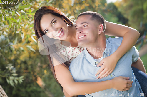 Image of Mixed Race Romantic Couple Portrait in the Park