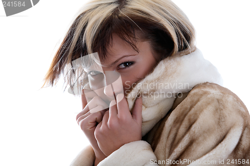 Image of Girl in fur coat on white background
