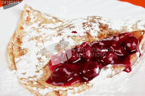 Image of pancakes with cherries