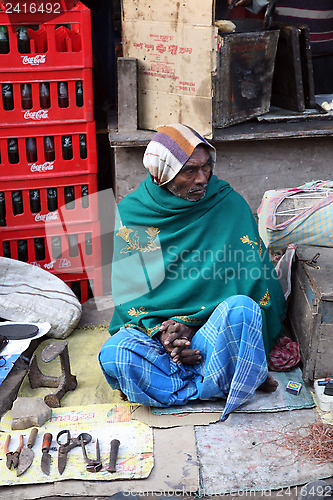 Image of Shoemaker working at the streets of Baruipur, West Bengal, India