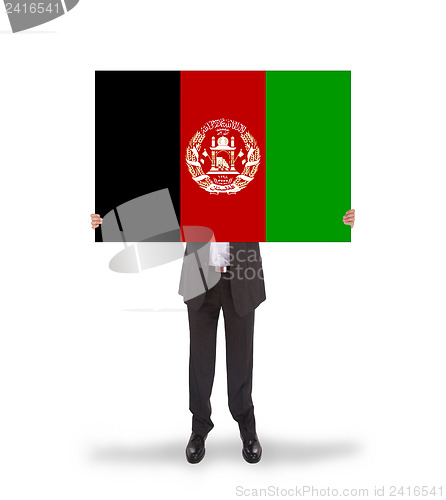 Image of Businessman holding a big card, flag of Afghanistan