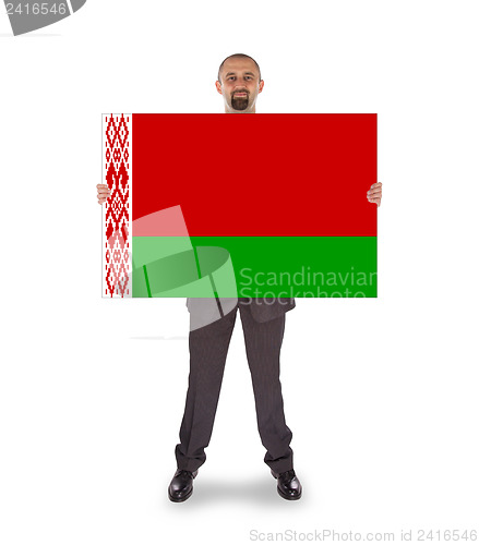 Image of Businessman holding a big card, flag of Belarus