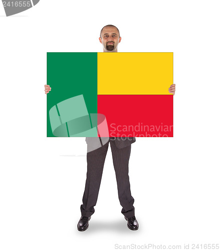 Image of Businessman holding a big card, flag of Benin