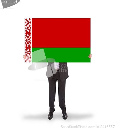Image of Businessman holding a big card, flag of Belarus
