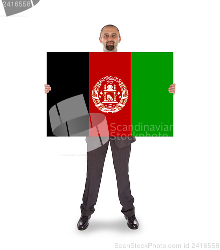 Image of Businessman holding a big card, flag of Afghanistan