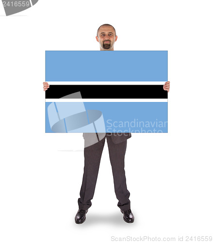 Image of Businessman holding a big card, flag of Botswana