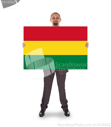 Image of Businessman holding a big card, flag of Bolivia