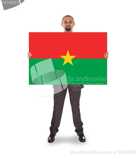 Image of Businessman holding a big card, flag of Burkina Faso
