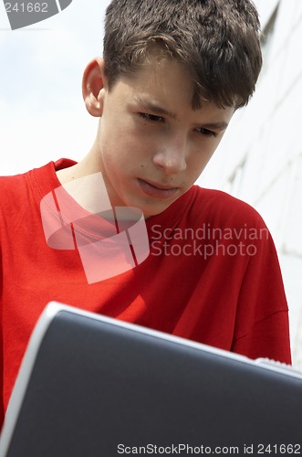 Image of teens with laptop