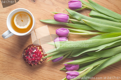 Image of Violet tulips on the wood