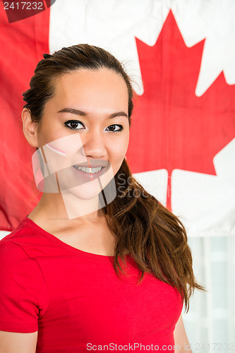 Image of Sportswoman Standing Against Canadian Flag